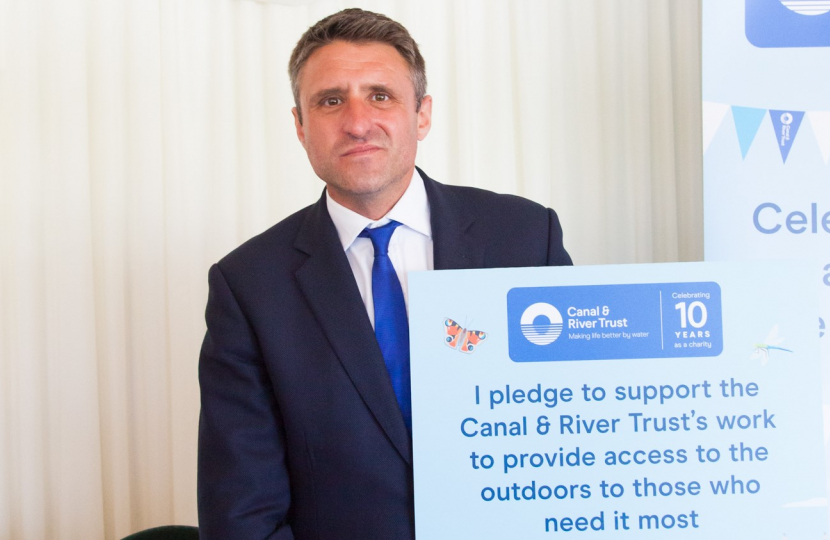 Ben Everitt MP Holding A Canal And River Trust Placard