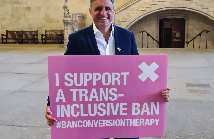 Ben Everitt MP Holding A Trans-Inclusive Conversion Therapy Ban Placard