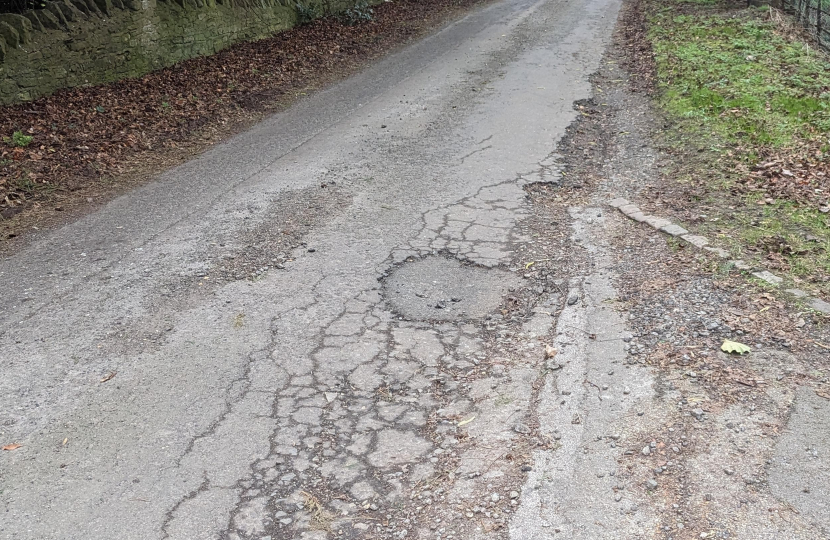 a badly damaged Milton Keynes road