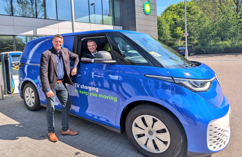 Transport Secretary Mark Harper at bp Pulse's Milton Keynes HQ with local MP Ben Everitt