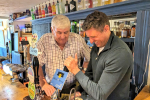 Ben Everitt MP with Cllr Keith McLean pulling a pint of Bell & Bear at the Bell & Bear pub in Emberton