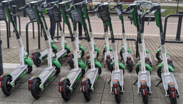 a row of e-scooters parked in Milton Keynes