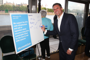 Ben Everitt MP Signing The Pledge To Ensure Access To Cash For Residents