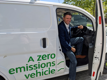 Ben Everitt MP in an electric vehicle