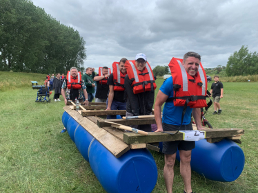 Ben leading his team out with the raft