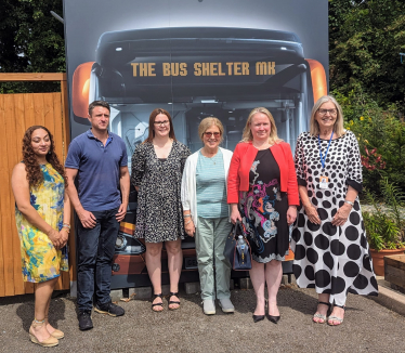 Ben Everitt MP with Minister Felicity Buchan (second from right) and members of the Bus Shelter MK team